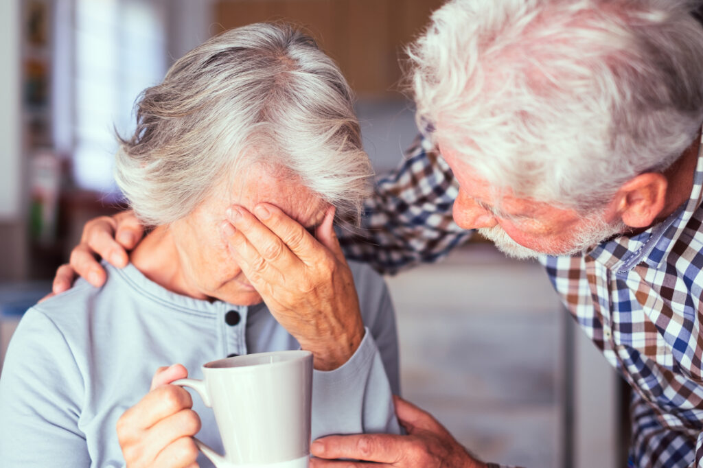 Elderly man comforting his wife who has Dementia | Elderly parents